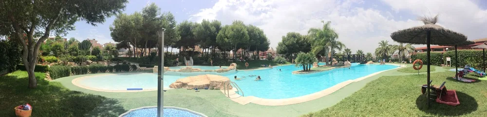 Gran Alacant resort with communal pool and palm trees